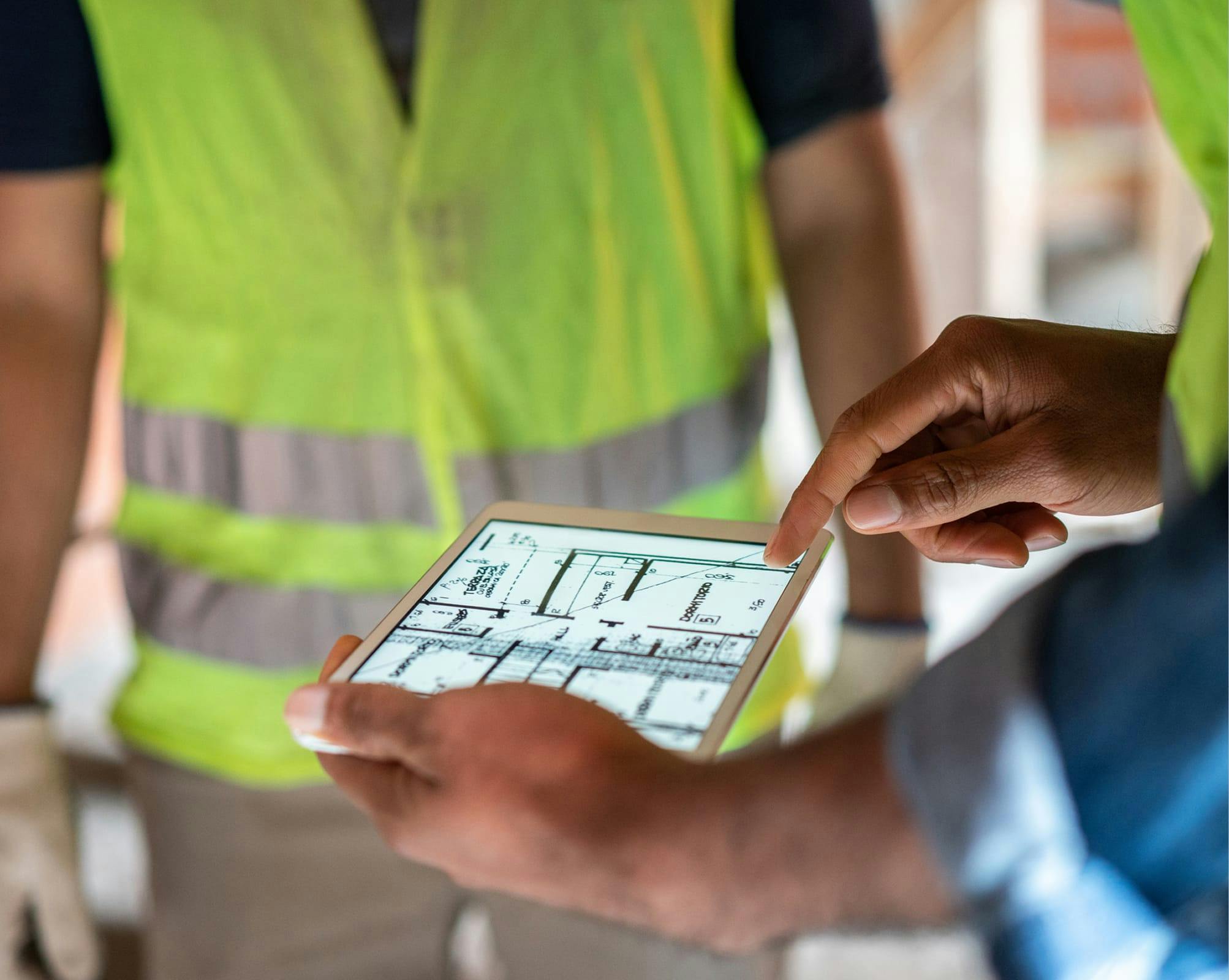 Workers lookingn at a blueprint
