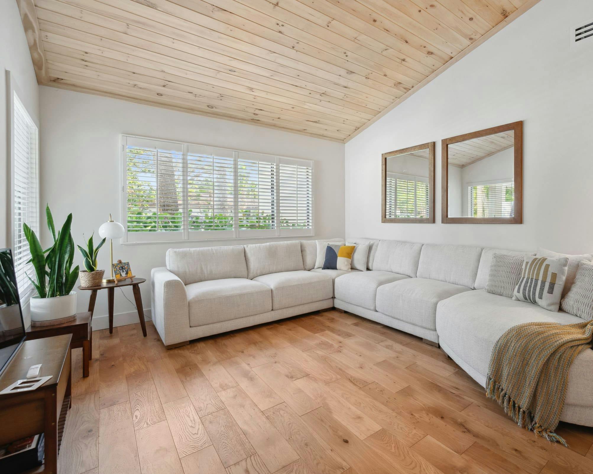 A sectional couch in a warm room